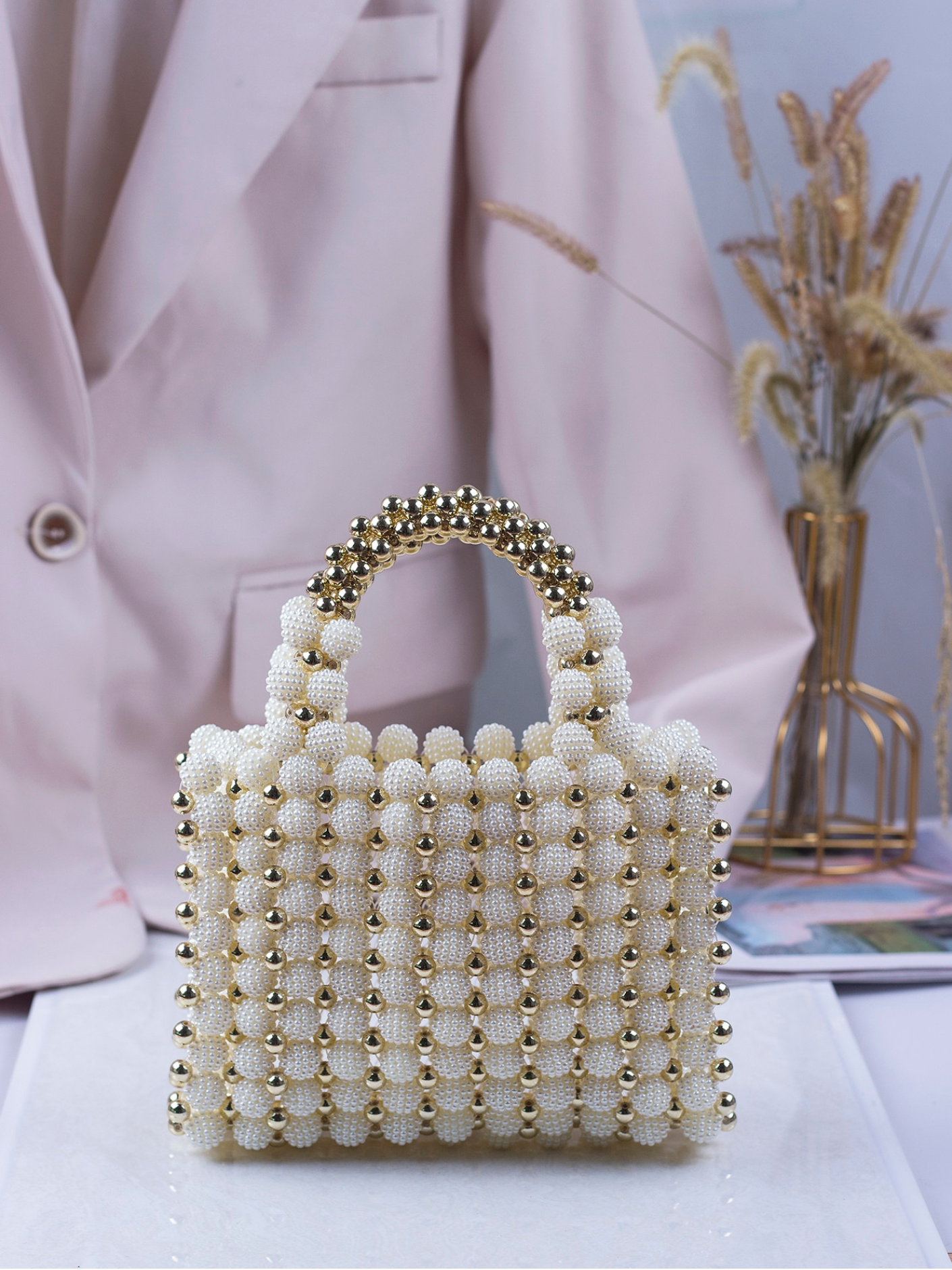 Bolso tejido perlas dorado