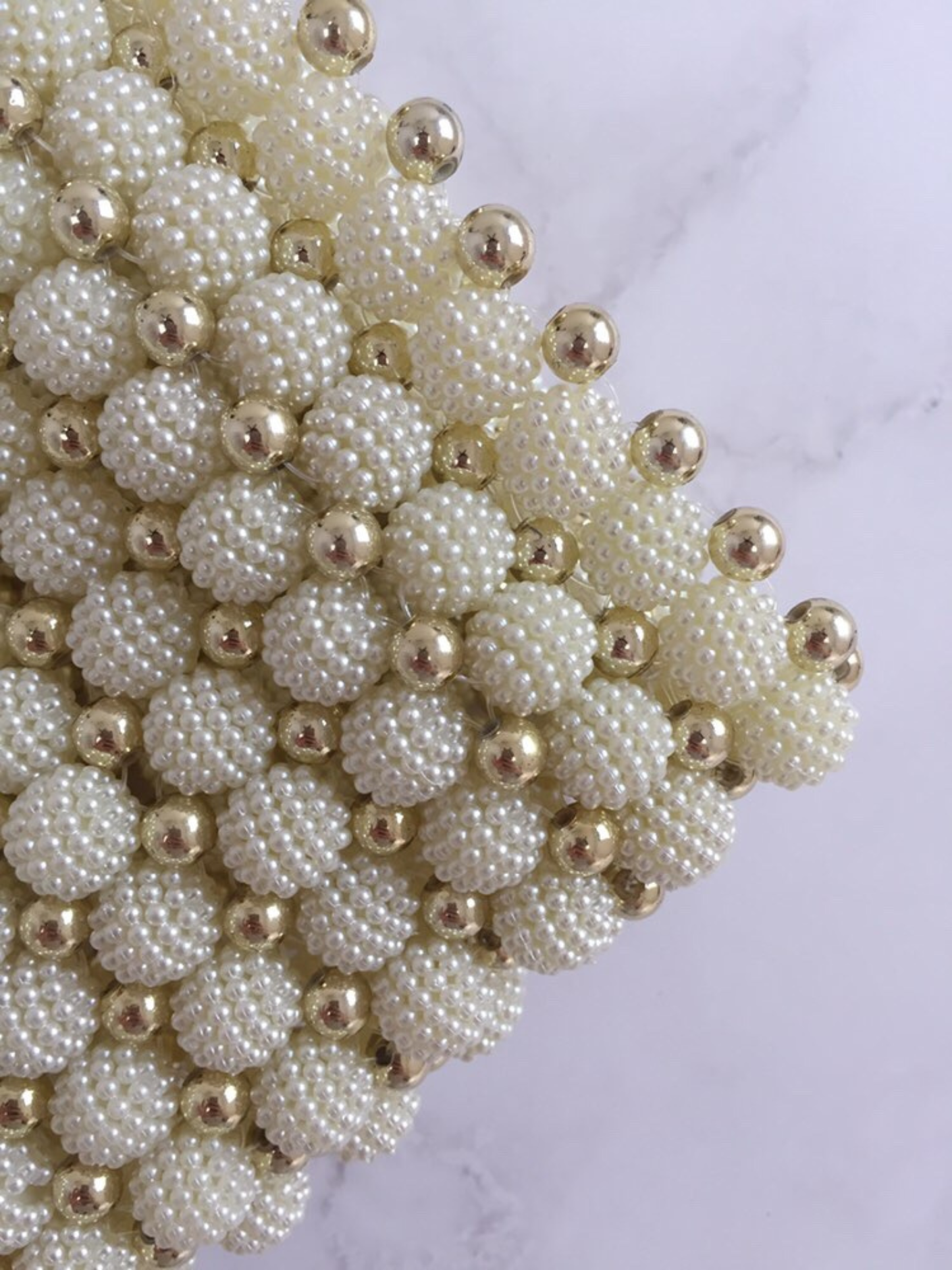Bolso tejido perlas dorado