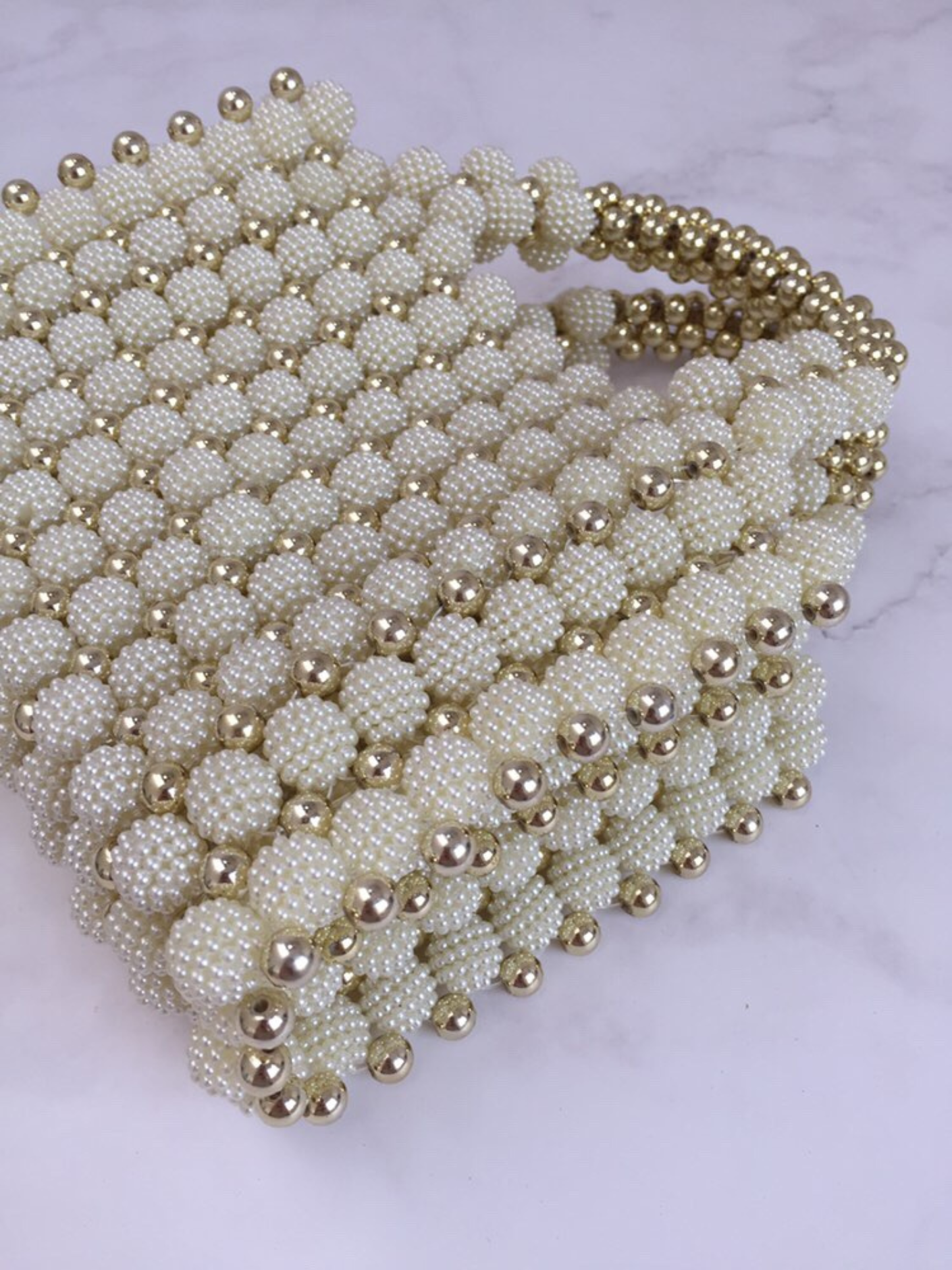 Bolso tejido perlas dorado