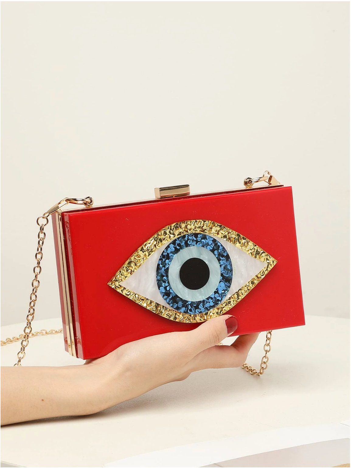 Bolso clutch ojo protector