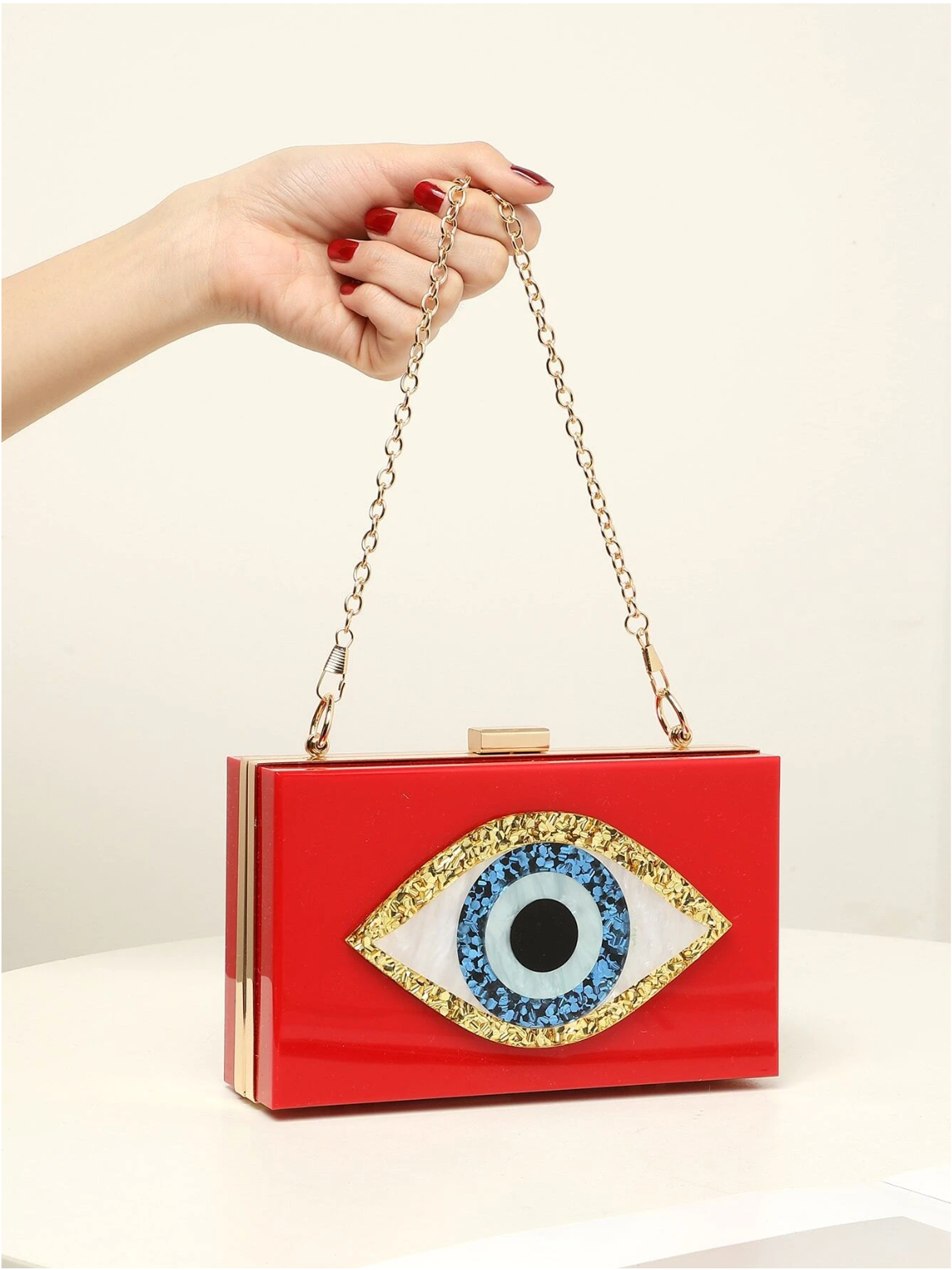 Bolso clutch ojo protector
