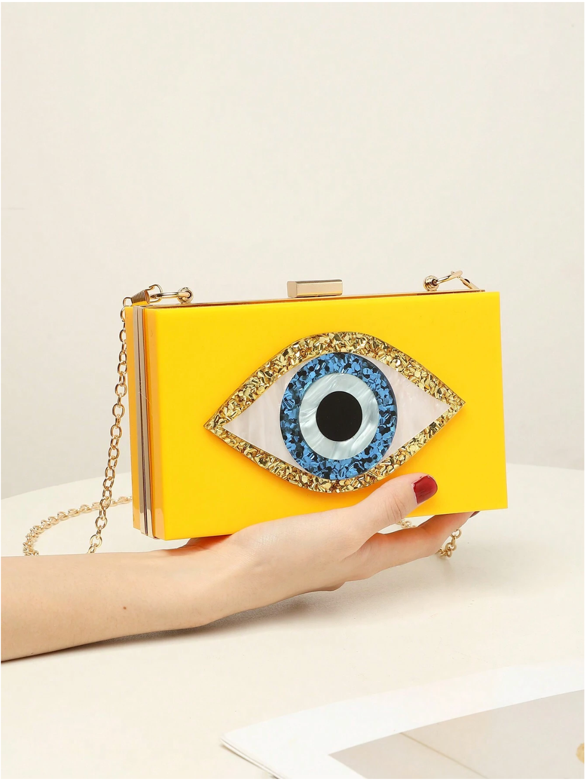 Bolso clutch ojo protector
